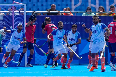 Harmanpreet Singh celebrates after scoring his side's first goal against Spain